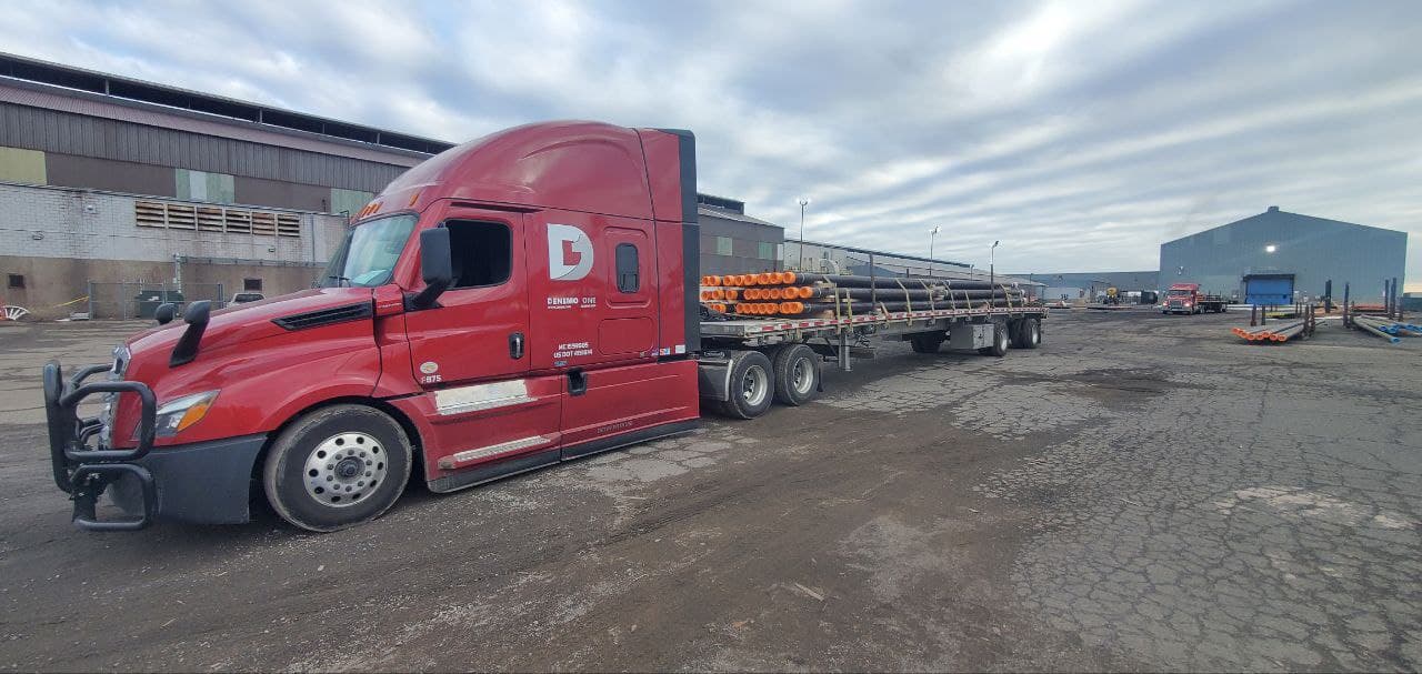 DENEMO One flatbed trailer hauling freight
